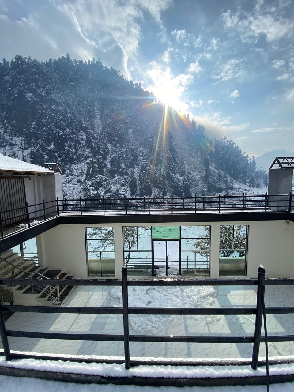 Comfort Inn Kalam rooftop balcony with stunning snowy mountain view